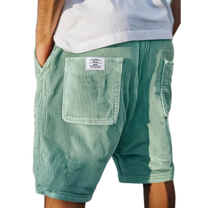 Grønne herreshorts med elastisk linning. Urban komfort og stil, inkl. lommer, ideel til en afslappet sommerdag.