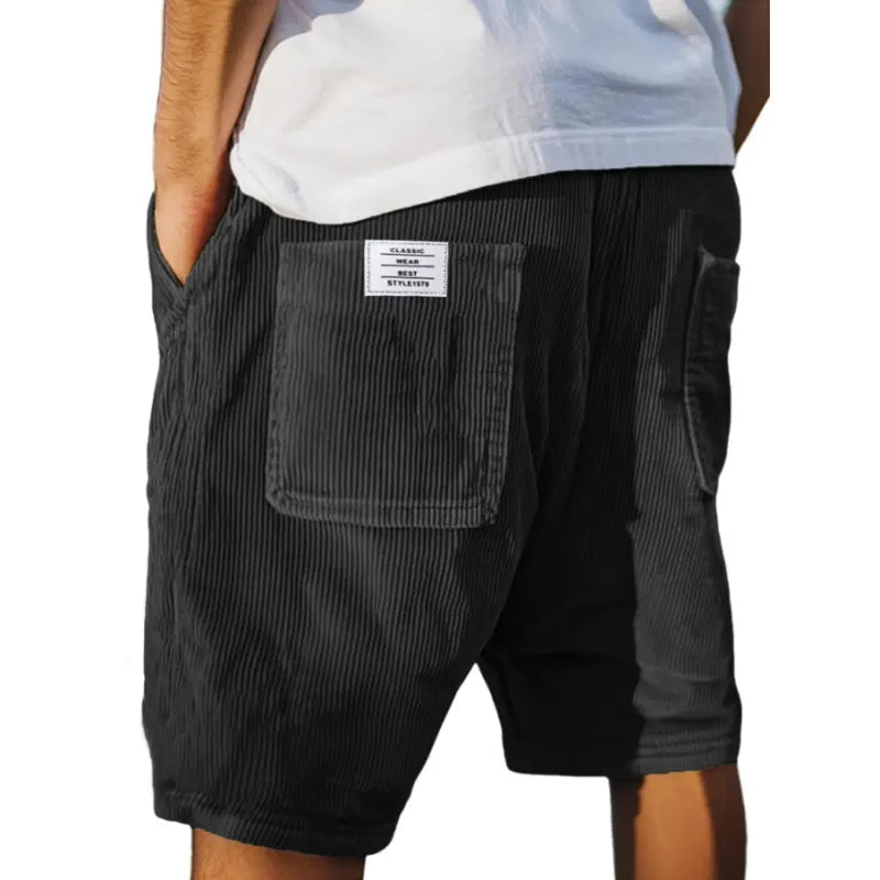 Sorte herreshorts: Elastisk linning for ultimativ komfort. Urban stil med lommer, perfekt til sommer og casual brug.