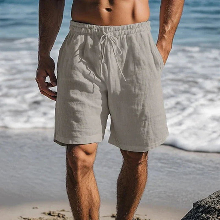 Stilfulde herre strandshorts i hør med afslappet pasform. Hurtigtørrende badeshorts ideelle til sommerdage.