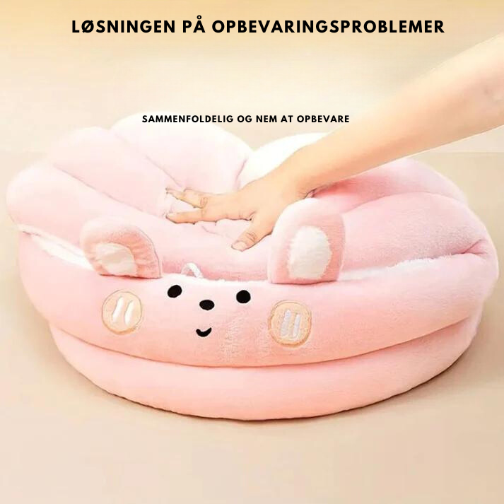 Rund kæledyrsrede i plys til hund og kat. Varm, blød soveplads, perfekt for hygge og afslapning.