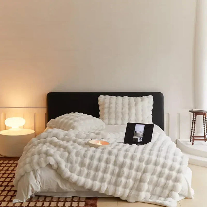Stort vintertæppe i plys for ultimativ varme og komfort; et must-have til hygge derhjemme.