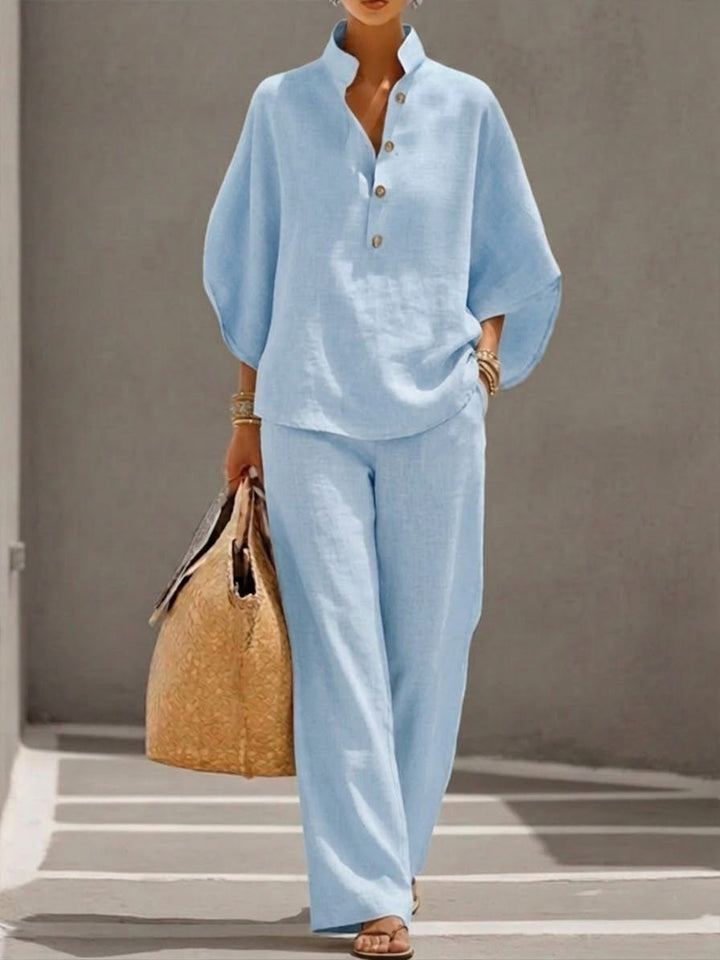Elegant 2-delt damensæt med batwing top og løse bukser, ideelt til forår og sommer.