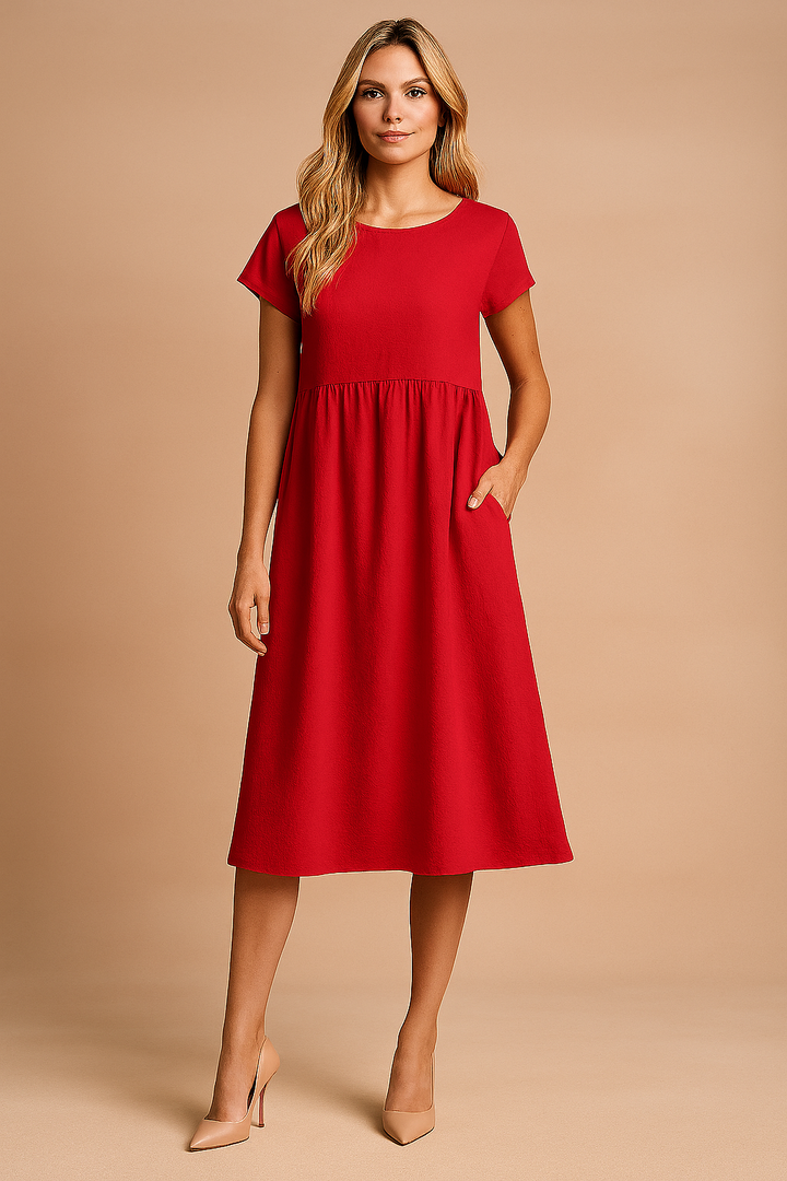 Alsidig kvindes sommerkjole. Let og luftig midi-kjole ideel til både afslappet og elegant look.