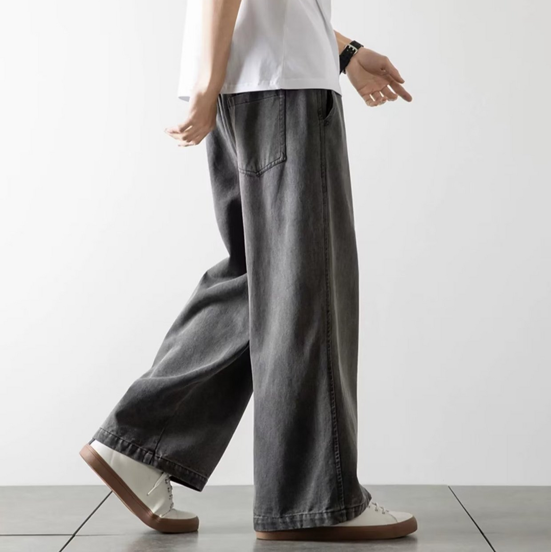 Detalje af elastiktalje på Calvix herre baggy jeans, der sikrer en komfortabel og fleksibel pasform.