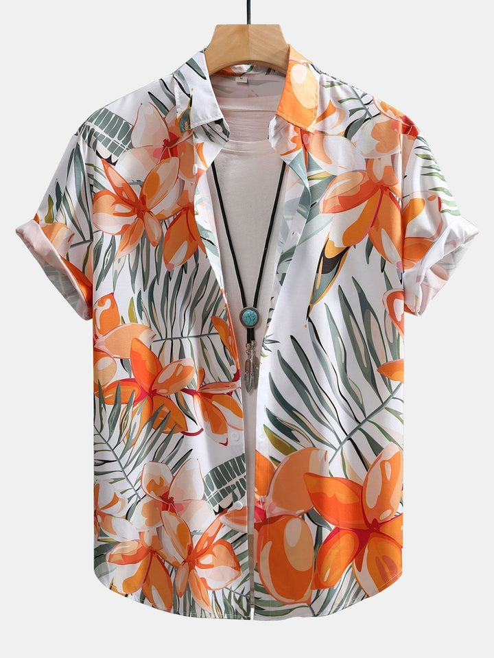 Mænds kortærmet sommerkjorte med levende tropisk blomsterprint, perfekt til afslappet stil og ferie.