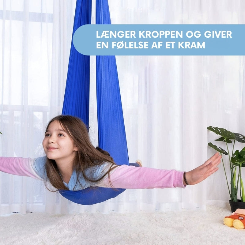 Sansegynge til børn, øger fokus og ro. Perfekt til indendørs leg og motorisk udvikling.