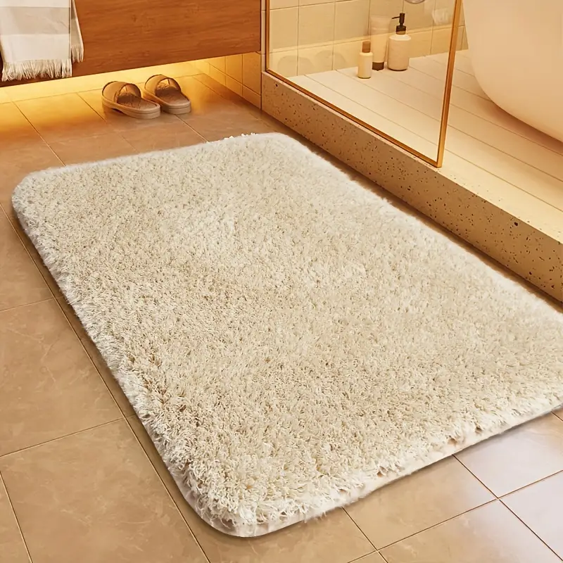 Stilfuld, rektangulær bademåtte i nordisk design. Perfekt til et moderne badeværelse, der søger komfort og sikkerhed.