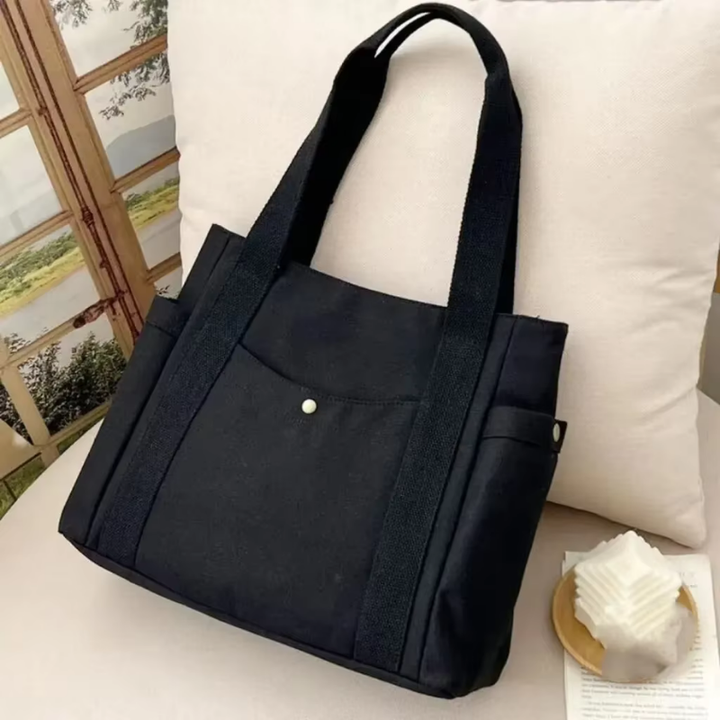 Elegant sort dame tote taske med flere rum. Perfekt som pendlertaske og skuldertaske.