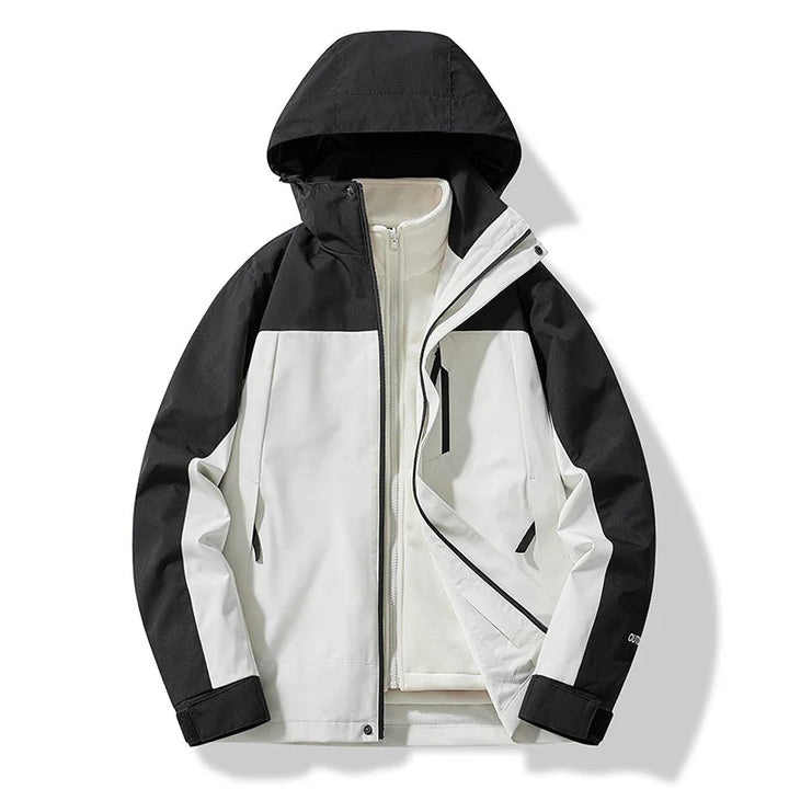 Stilfuld unisex outdoor jakke med hætte. Perfekt som varm vinterjakke til mænd og kvinder på pisterne.
